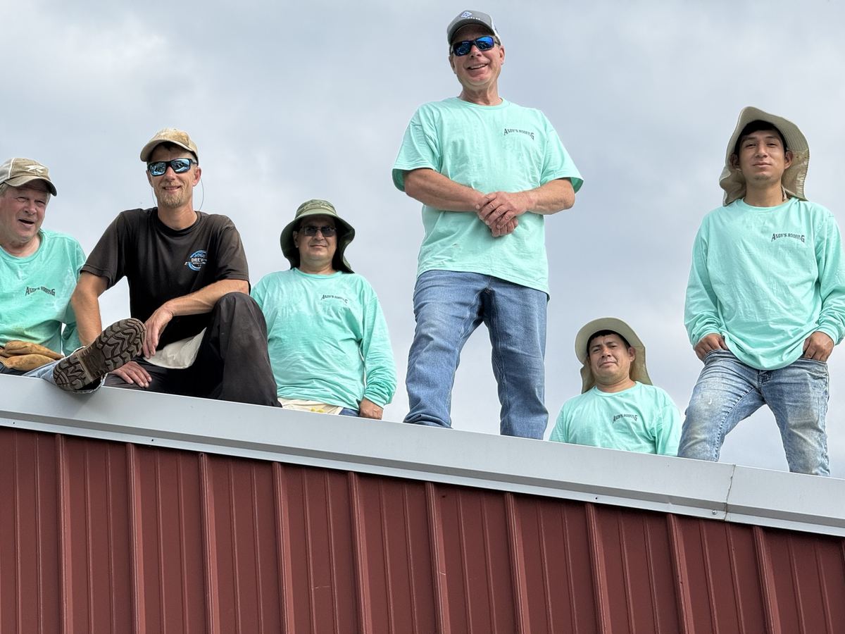 The crew on a barn ridge