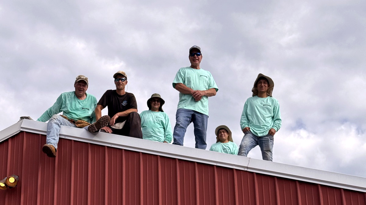 The Andy's Roofing crew on a finished roof